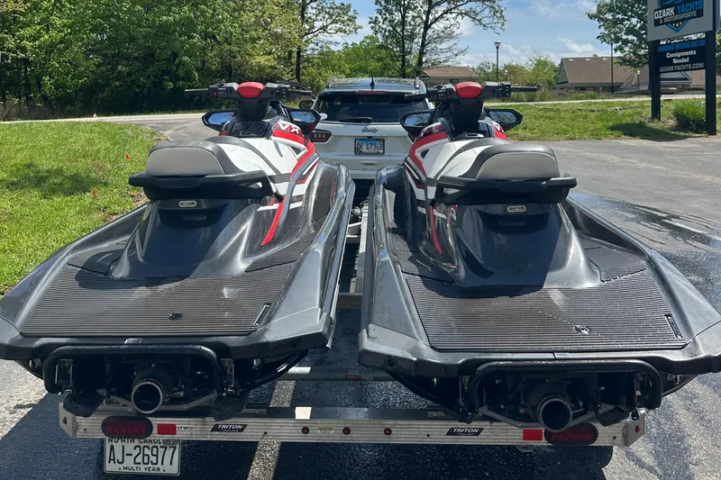 Slide: The Image of Two 2019 Yamaha WaveRunner VX Cruiser HO jet skis on a trailer in a parking lot. - 3