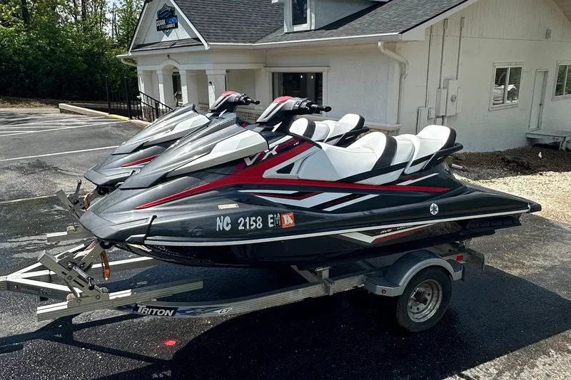 Slide: The Image of 2019 Yamaha WaveRunner VX Cruiser HO jet skis on a trailer outside a building. - 4
