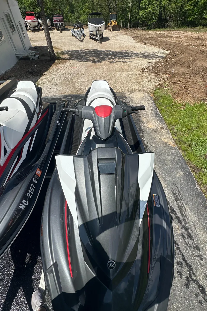 Slide: The Image of 2019 Yamaha WaveRunner VX Cruiser HO parked on a driveway, surrounded by greenery. - 7