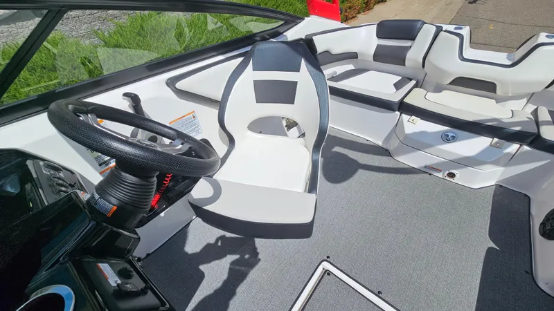 Slide: The Image of 2019 Yamaha Boats AR195 interior with steering wheel and seating area. - 10