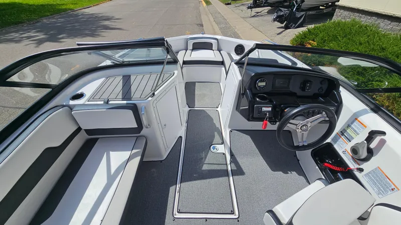 Slide: The Image of 2019 Yamaha Boats AR195 interior with sleek design and modern dashboard. - 14