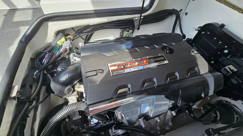 Slide: The Image of 2019 Yamaha AR195 boat engine compartment with visible wiring and components. - 21