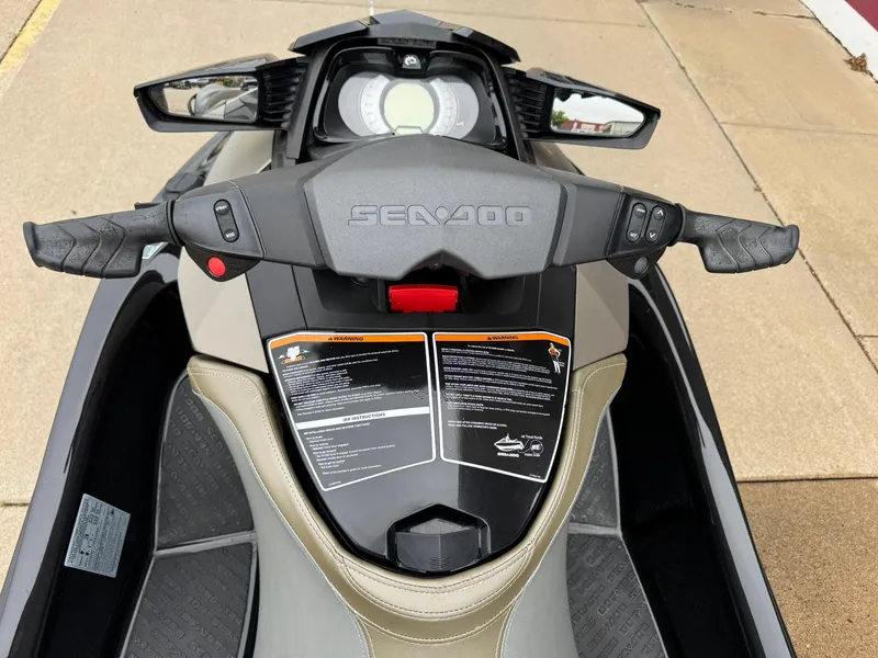 Slide: The Image of 2017 Sea-Doo GTX155 jet ski dashboard and handlebars, featuring control panel and safety instructions. - 11
