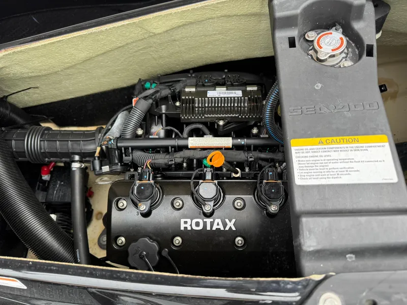 Slide: The Image of 2017 Sea-Doo GTX155 engine compartment featuring a Rotax engine. - 12