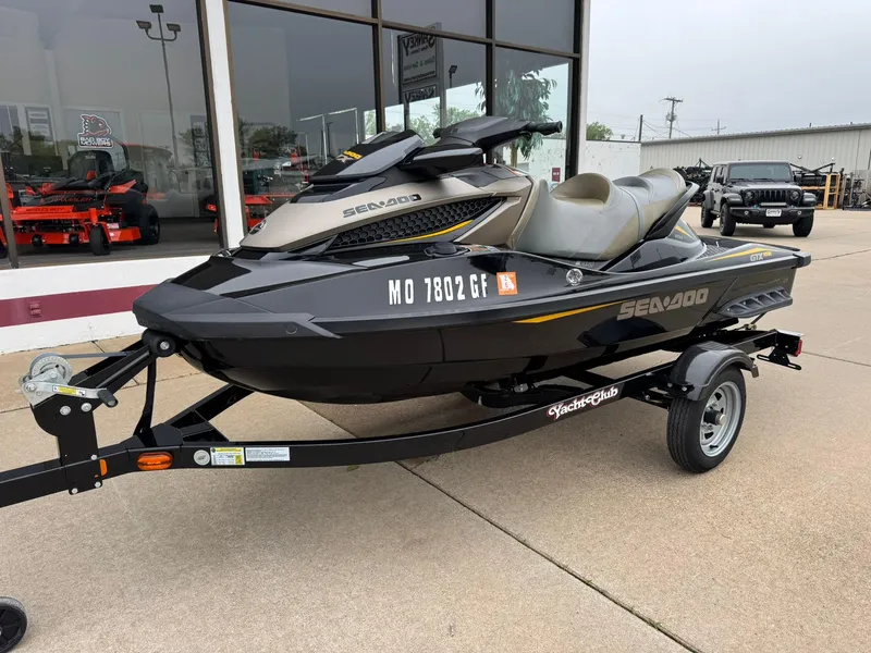 Slide: The Image of 2017 Sea-Doo GTX155 jet ski on trailer, parked outside dealership. - 3