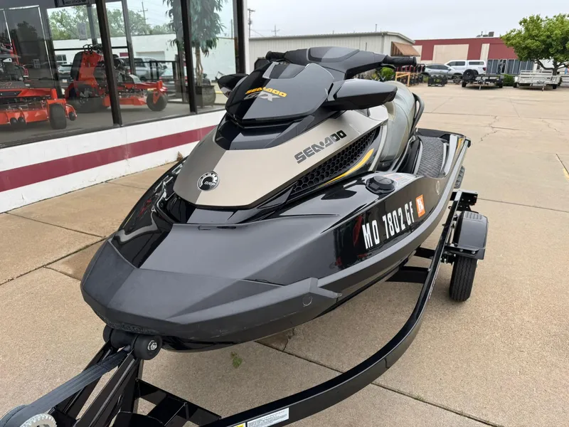 Slide: The Image of 2017 Sea-Doo GTX155 jet ski on trailer, parked outside a dealership. - 4