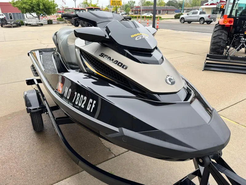 Slide: The Image of 2017 Sea-Doo GTX155 jet ski on trailer, parked outdoors. - 5