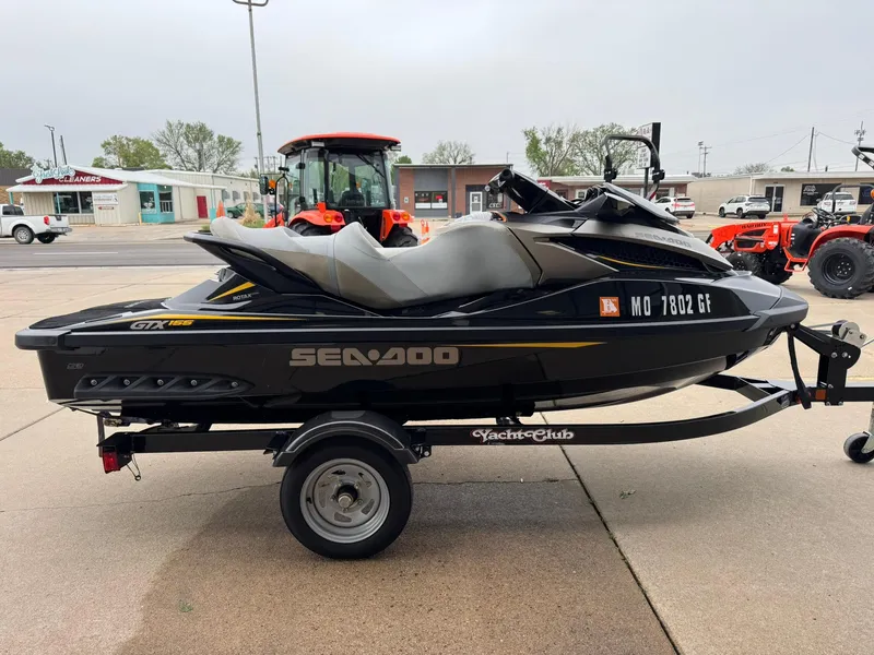 Slide: The Image of 2017 Sea-Doo GTX155 jet ski on trailer, parked outdoors. - 7