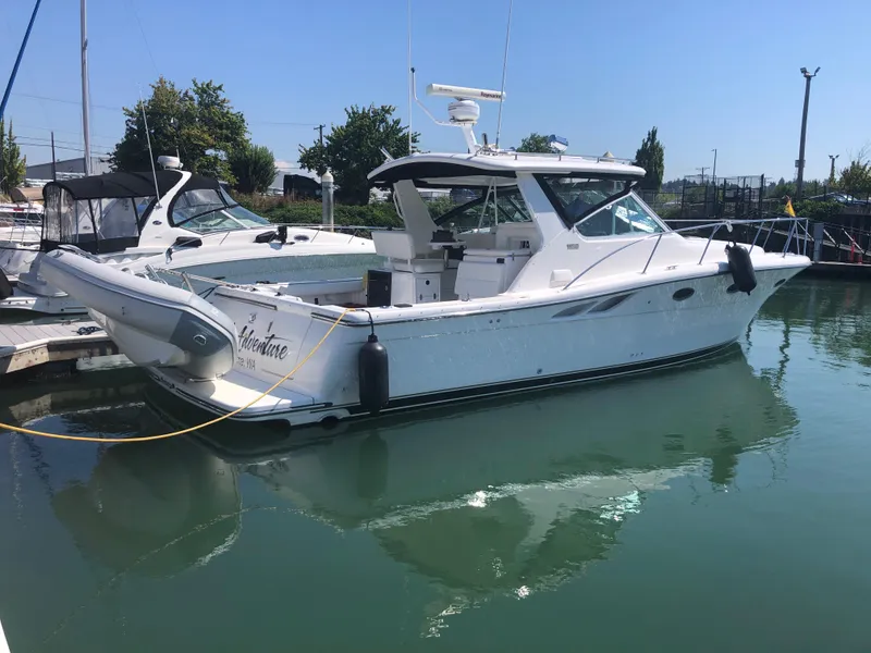 Slide: The Image of 2003 Tiara Yachts 3500 Open docked in a marina on a sunny day. - 11