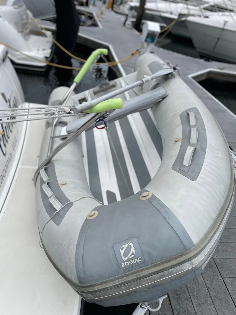 Slide: The Image of Inflatable Zodiac boat docked beside a 2003 Tiara Yachts 3500 Open. - 18
