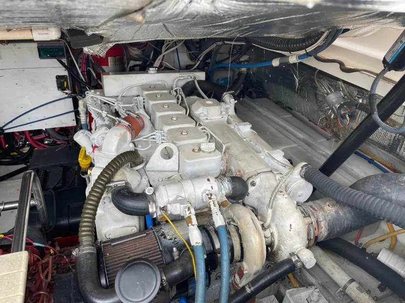 Slide: The Image of Engine compartment of a 2003 Tiara Yachts 3500 Open, showcasing detailed mechanical components. - 20