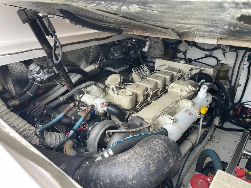 Slide: The Image of Engine compartment of a 2003 Tiara Yachts 3500 Open, showcasing detailed mechanical components. - 22