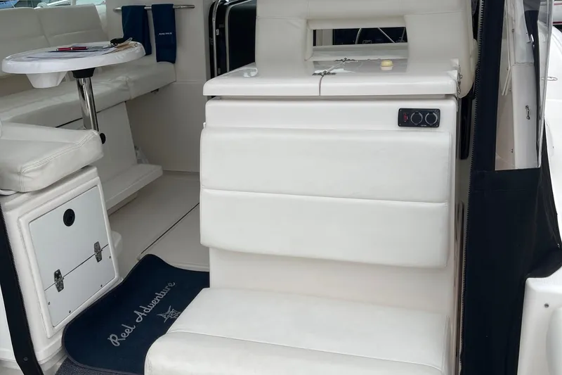 Slide: The Image of 2003 Tiara Yachts 3500 Open interior with white seating and table. - 28