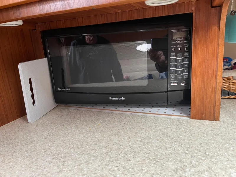 Slide: The Image of Panasonic microwave in a 2003 Tiara Yachts 3500 Open kitchen area. - 34