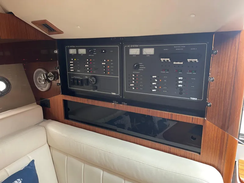 Slide: The Image of 2003 Tiara Yachts 3500 Open interior control panel with wood finish and seating. - 39