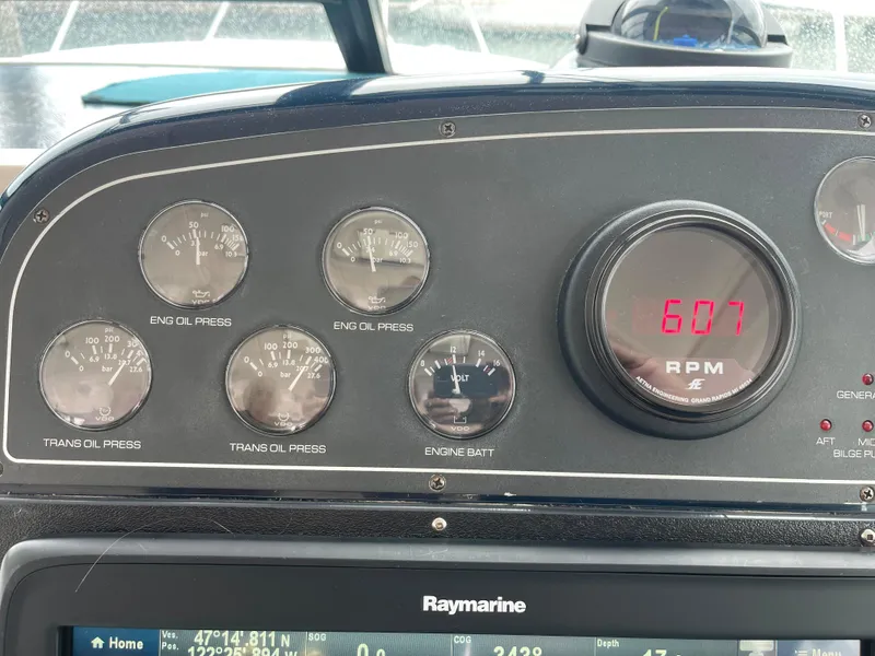 Slide: The Image of Dashboard of a 2003 Tiara Yachts 3500 Open, showing engine gauges and RPM display. - 41