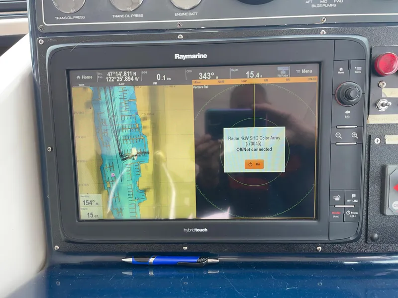 Slide: The Image of Raymarine navigation display on 2003 Tiara Yachts 3500 Open, showing map and radar. - 43
