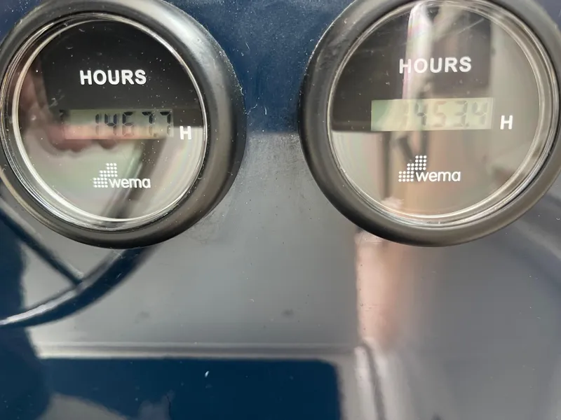 Slide: The Image of Hour meters on a 2003 Tiara Yachts 3500 Open, displaying 1467.7 and 1534 hours. - 45