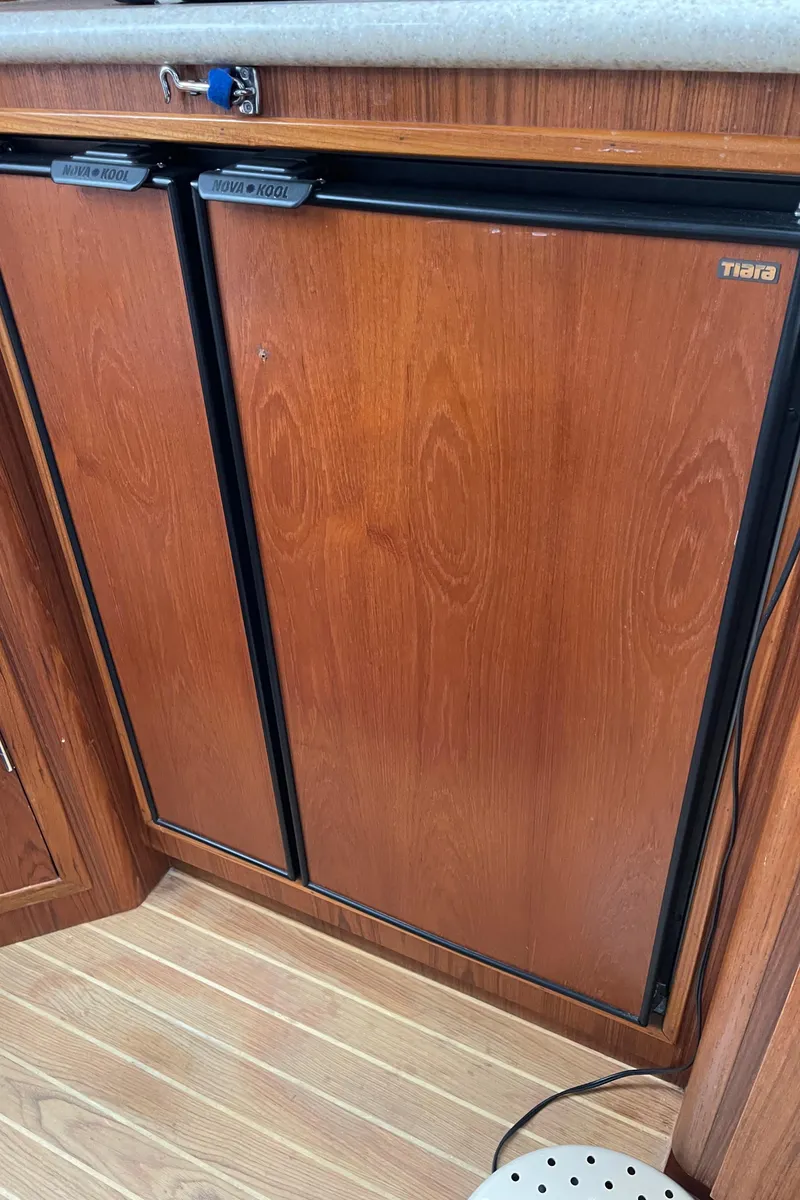 Slide: The Image of 2003 Tiara Yachts 3500 Open wooden cabinet interior detail. - 47