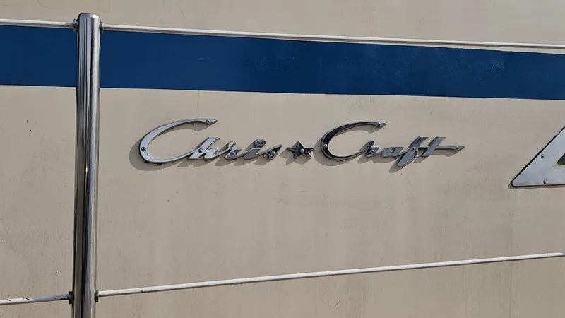 Slide: The Image of 1982 Chris-Craft 381 Catalina logo on boat exterior with blue stripe. - 20