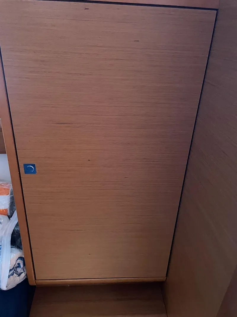 Slide: The Image of Wooden cabinet door inside 2017 Jeanneau Sun Odyssey 479 yacht interior. - 31