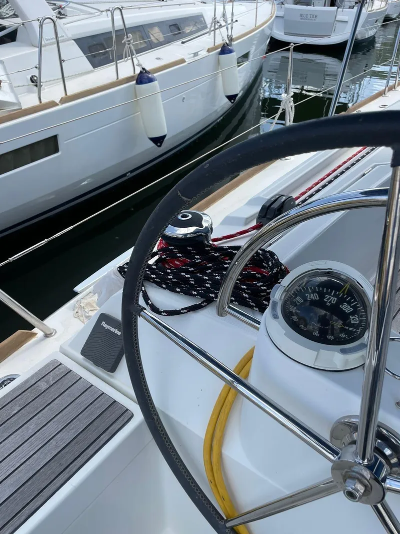 Slide: The Image of Steering wheel and compass on 2017 Jeanneau Sun Odyssey 479 sailboat. - 35