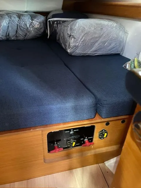 Slide: The Image of Interior cabin of 2017 Jeanneau Sun Odyssey 479 yacht with blue cushions. - 42