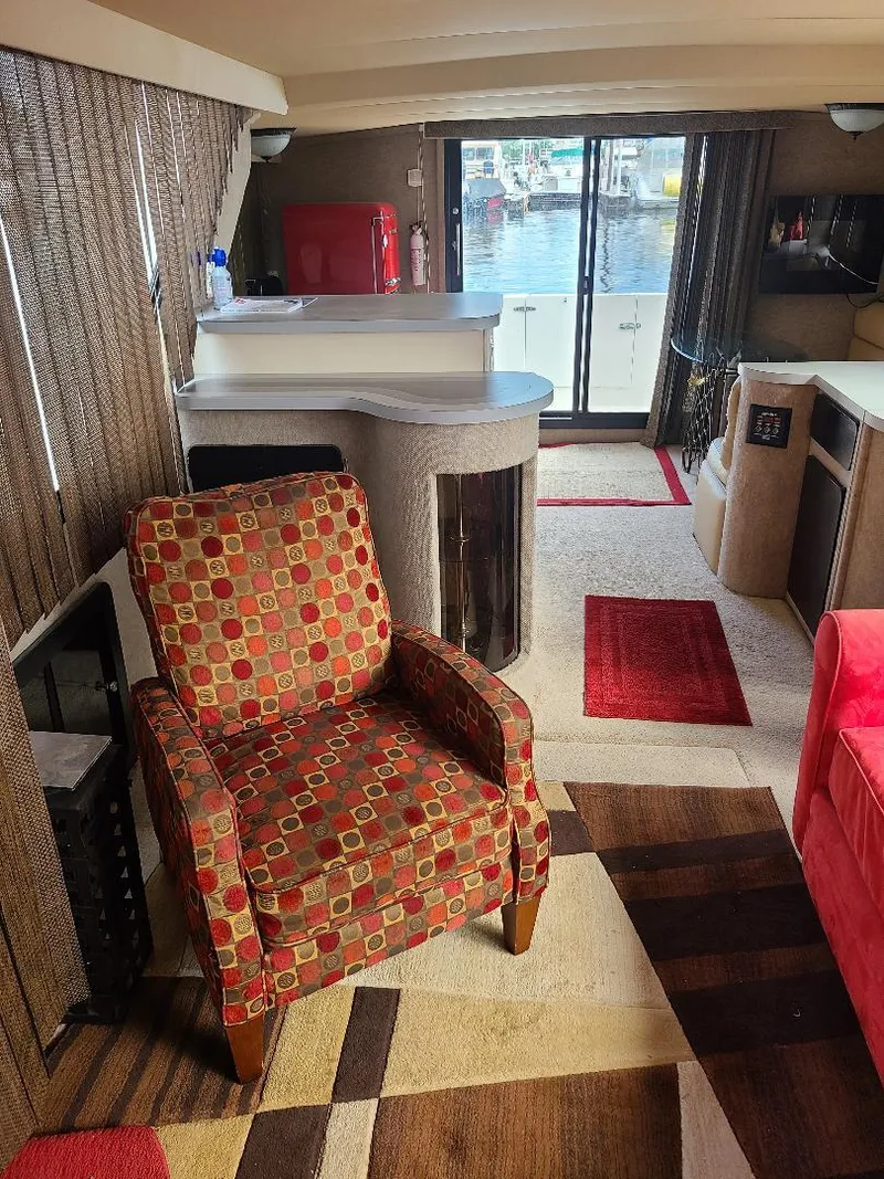 Slide: The Image of Interior of 1989 Bluewater Yachts Coastal Cruiser 42 with patterned chair and modern decor. - 13