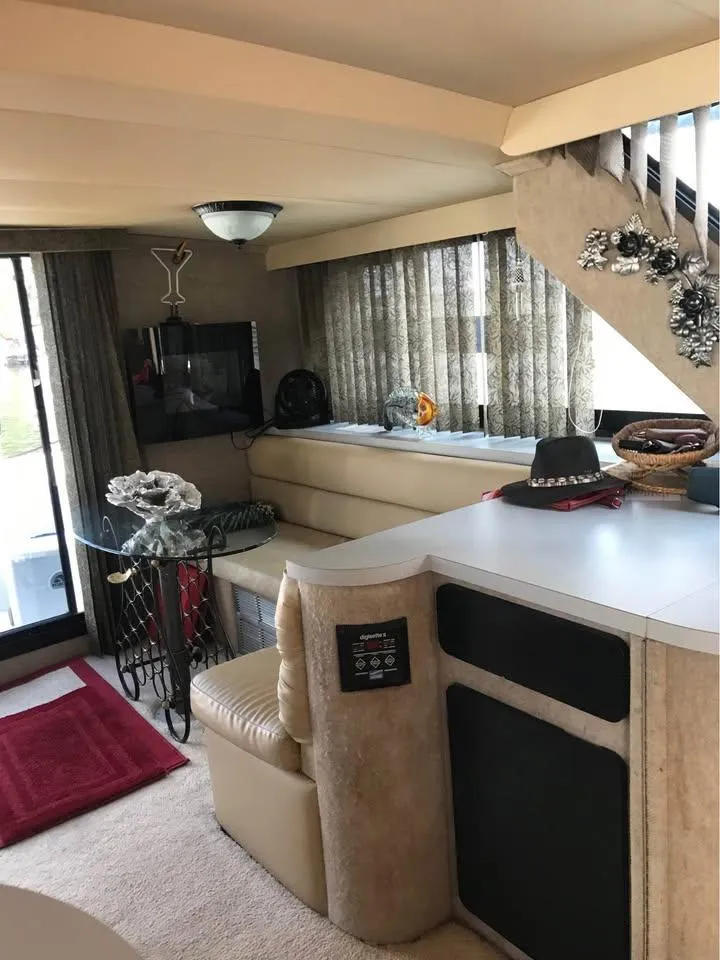 Slide: The Image of Interior of 1989 Bluewater Yachts Coastal Cruiser 42 with cozy seating and modern decor. - 2