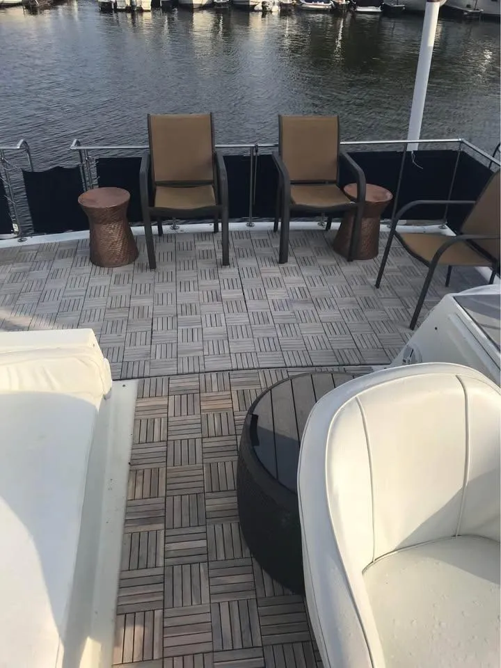 Slide: The Image of 1989 Bluewater Yachts Coastal Cruiser 42 deck with chairs and water view. - 6