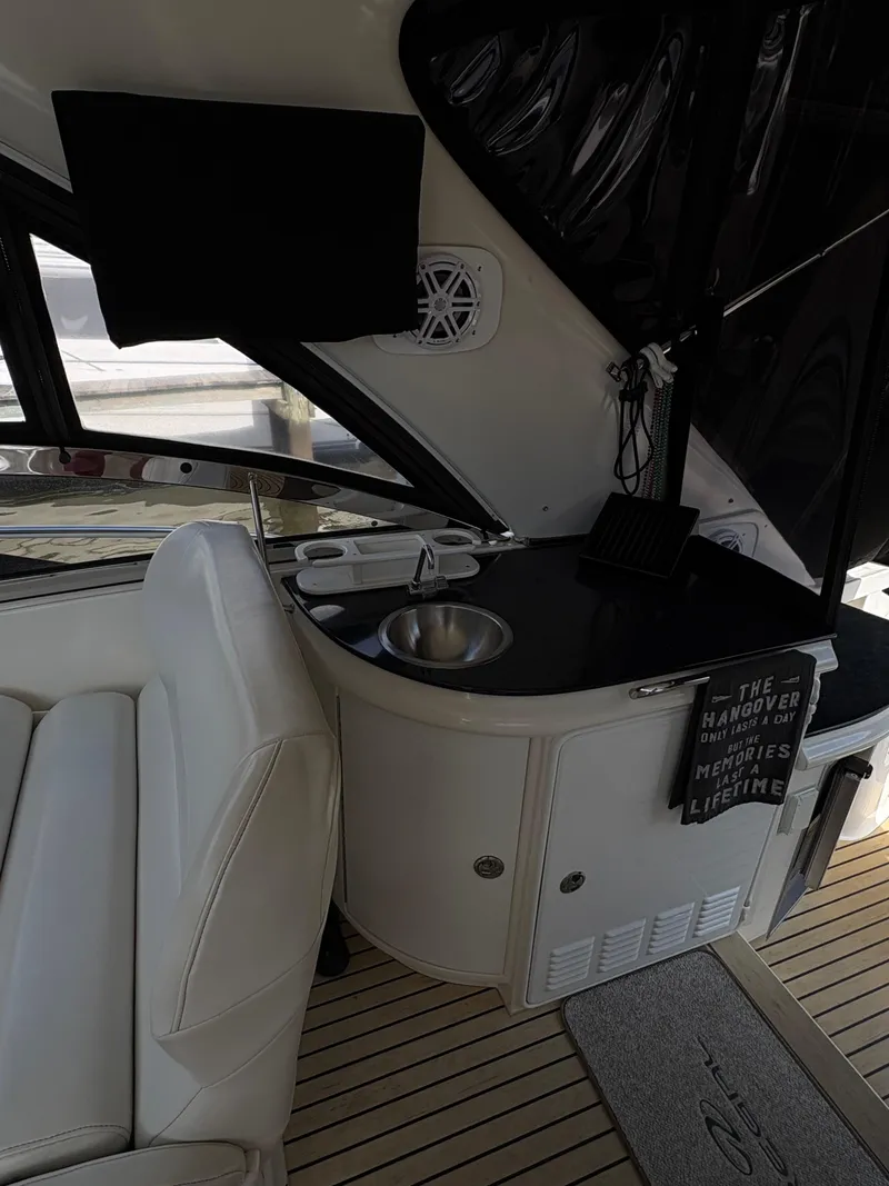 Slide: The Image of 2003 Regal 4260 Express Cruiser interior with sink and seating area. - 12