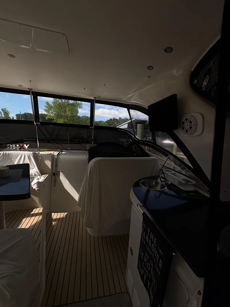 Slide: The Image of Interior of 2003 Regal 4260 Express Cruiser with seating and entertainment area. - 15