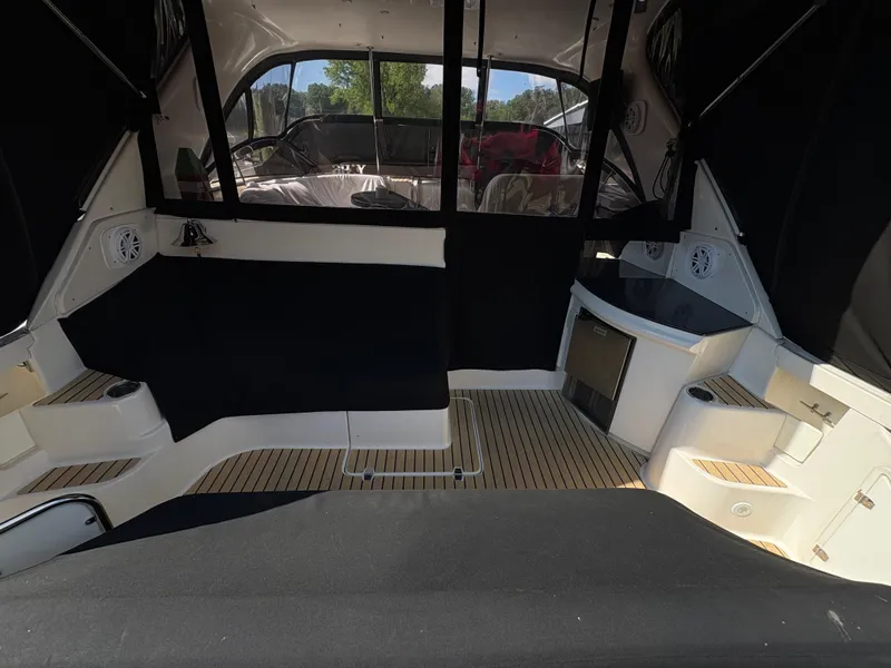 Slide: The Image of 2003 Regal 4260 Express Cruiser interior with seating and wood flooring. - 17