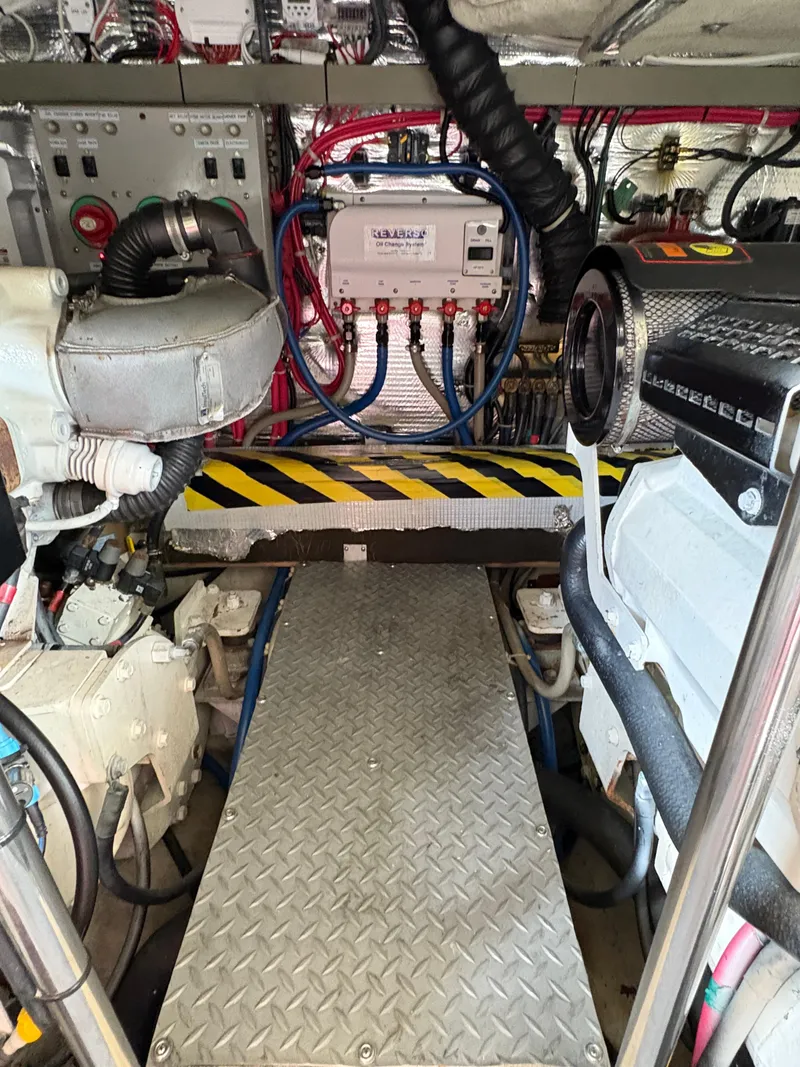 Slide: The Image of Engine room of 2003 Regal 4260 Express Cruiser with visible machinery and wiring. - 6