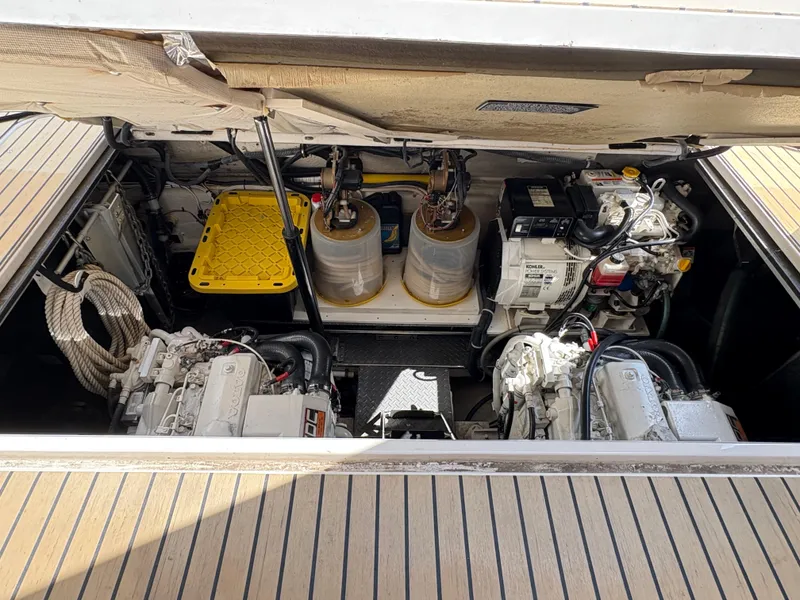 Slide: The Image of Engine compartment of 2003 Regal 4260 Express Cruiser, showcasing dual engines and equipment. - 7