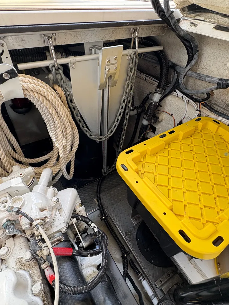 Slide: The Image of Engine room of 2003 Regal 4260 Express Cruiser with ropes and yellow storage bin. - 8
