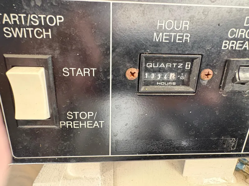 Slide: The Image of Control panel of a 2003 Regal 4260 Express Cruiser with hour meter reading 1334.4 hours. - 9