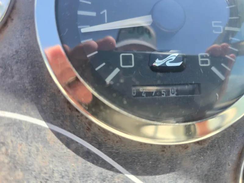 Slide: The Image of Close-up of a 1998 Sea Ray 240 Sundancer boat gauge displaying 847.5 hours. - 12