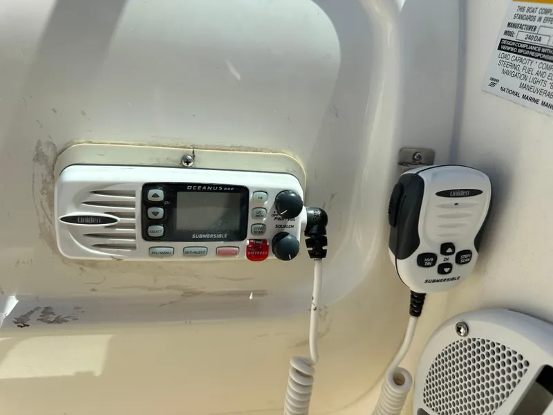 Slide: The Image of 1998 Sea Ray 240 Sundancer boat radio and communication equipment. - 14