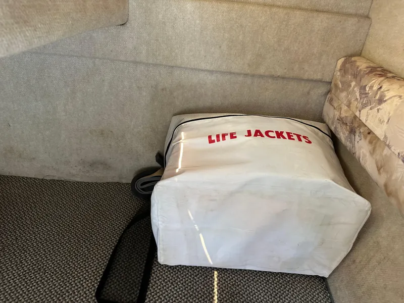 Slide: The Image of Life jackets stored in a Sea Ray 240 Sundancer cabin, 1998 model. - 30