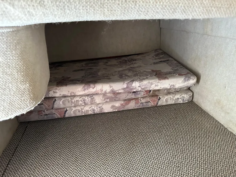 Slide: The Image of Cushioned storage area inside 1998 Sea Ray 240 Sundancer boat. - 31