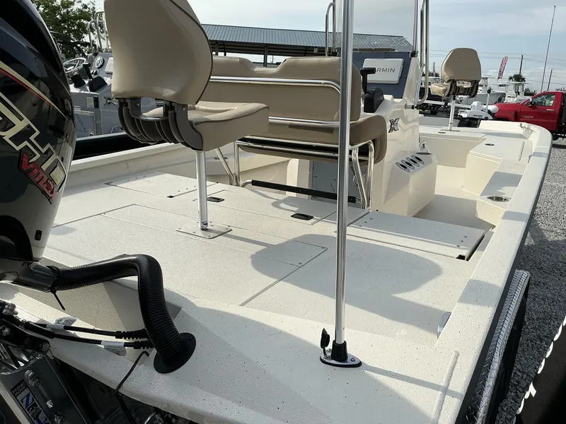 Slide: The Image of 2025 Xpress Hyper-Lift Series H22B boat interior with seating and motor, showcasing spacious design. - 6