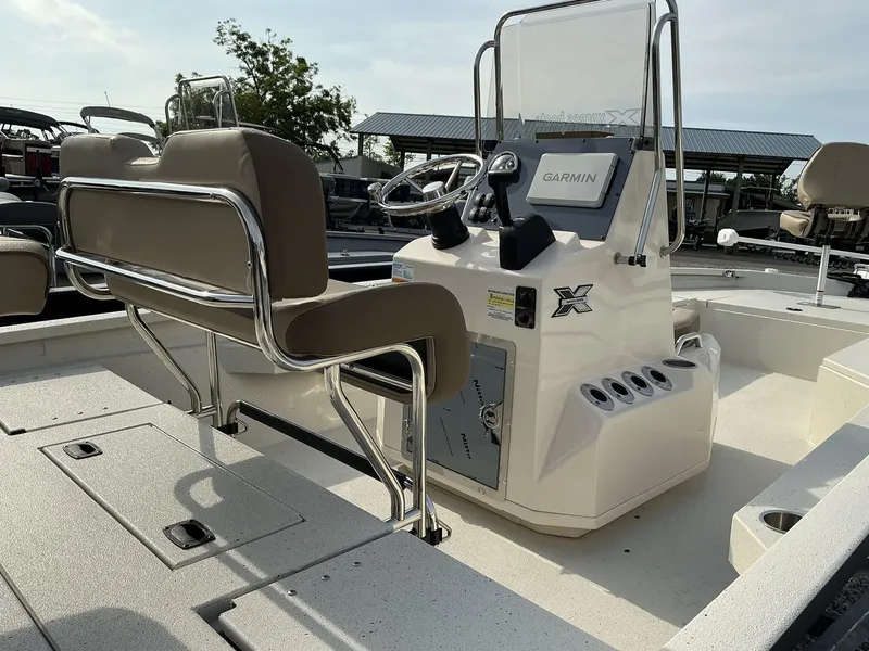 Slide: The Image of 2025 Xpress Hyper-Lift Series H22B boat interior with Garmin system and seating. - 5