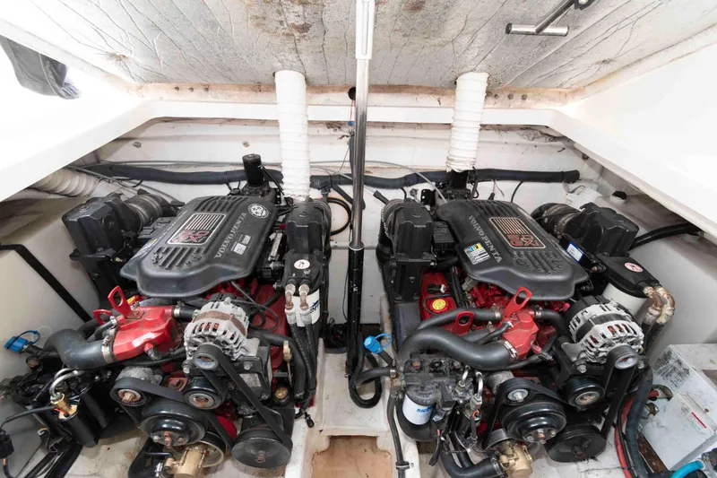 Slide: The Image of Engine compartment of a 2007 Rinker 300 Express Cruiser with dual engines. - 17