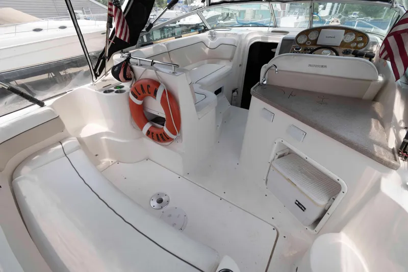 Slide: The Image of 2007 Rinker 300 Express Cruiser interior with seating, life preserver, and control panel. - 3