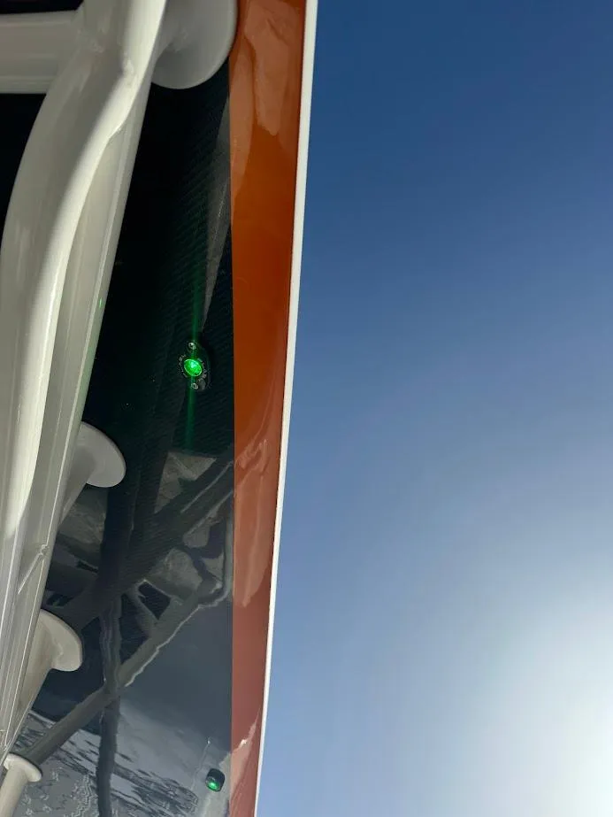 Slide: The Image of 2015 Deep Impact 399 Cabin boat detail against clear blue sky. - 22