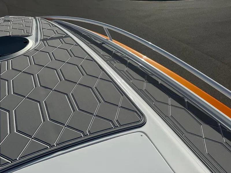 Slide: The Image of 2015 Deep Impact 399 Cabin boat deck with hexagonal pattern design. - 25