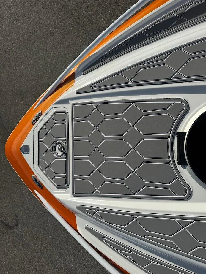 Slide: The Image of Bow of 2015 Deep Impact 399 Cabin boat with orange and gray detailing. - 28