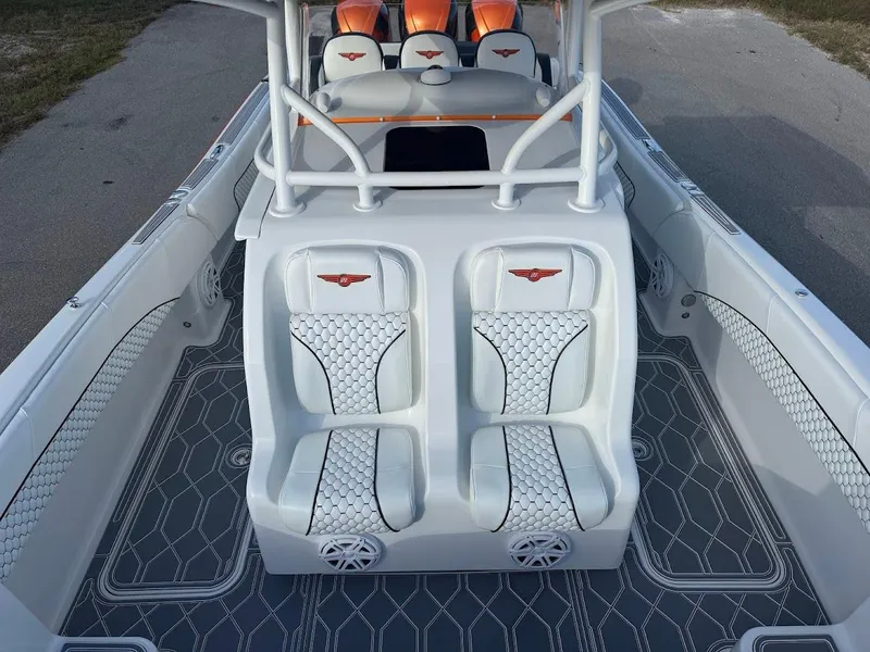 Slide: The Image of 2015 Deep Impact 399 Cabin boat with white seating and geometric flooring design. - 32