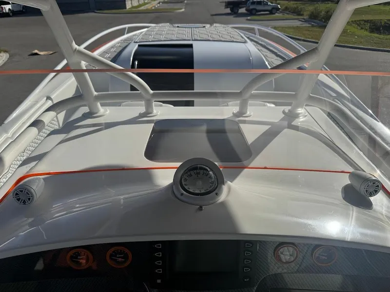 Slide: The Image of 2015 Deep Impact 399 Cabin boat dashboard with gauges and controls, viewed from above. - 41
